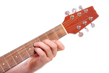 hand is playing the guitar in closeup