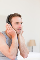 Fototapeta premium Handsome man listening to some music