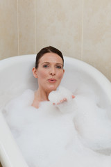 Beautiful woman taking a bath