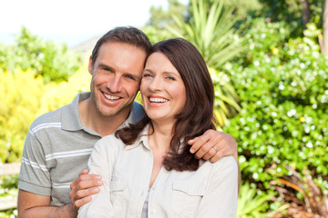 Naklejka premium Beautiful woman with her husband in the garden
