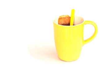 Tea, cup and spoon on isolated background.