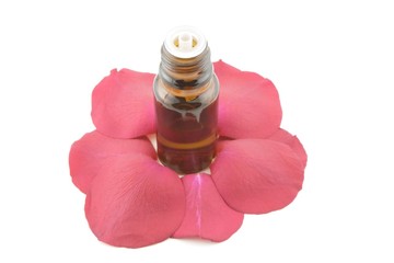 essential oil and rose petals