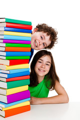 Kids behind pile of books isolated on white background