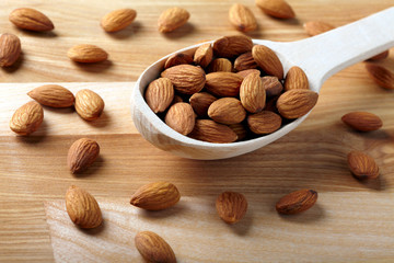 Almonds on wooden background