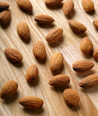 Almonds on wooden background