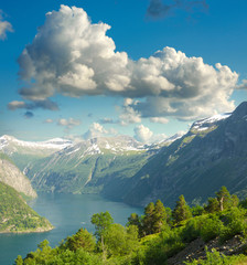 Summer landscape. Blue sky, mountains and fjord