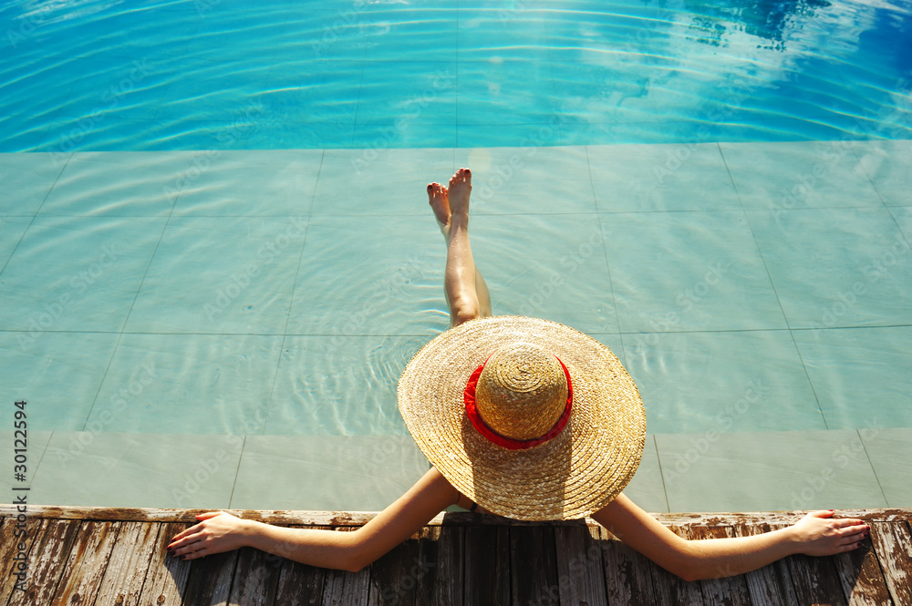 Wall mural woman at poolside