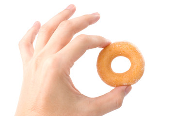 Lovely mini donut in man's hand