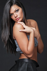 Fototapeta premium Young attractive woman with long black hair.