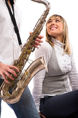 Man plays the saxophone for his lovely girlfriend