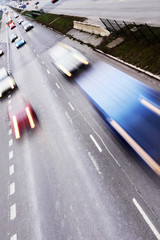 Highway with lots of cars. High contrast and motion blur to rise