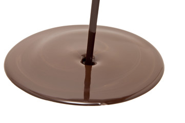 Chocolate flow isolated on white background close up