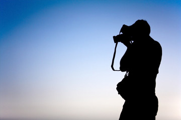 the shadow of one photographer taking a picture