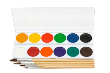 Brushes and paint on a white background.