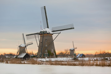 Fototapeta na wymiar windmills in Kinderdijk at winter sunset