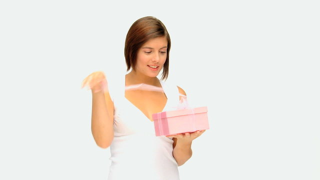Cute brown-haired lady opening a gift