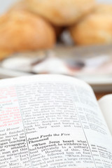 Fototapeta premium Bible with text in Matthew 14 - Feeding the five thousand