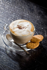 Cappuccino su tavolo di vetro Nero