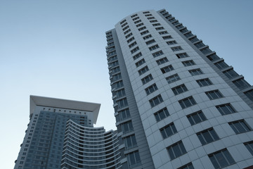 Fototapeta premium modern glass silhouettes of skyscrapers at night