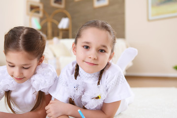 twin sisters together at home