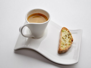 A cup of espresso with cantuccini
