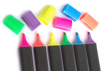 Five black color markers with open caps on white background