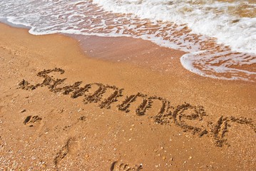 summer word on a sea sand