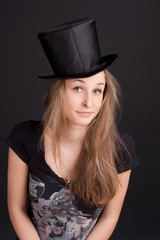 Pretty young girl in a cylinder