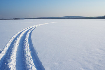 Fototapeta na wymiar Traces on a snow. Winter landscape