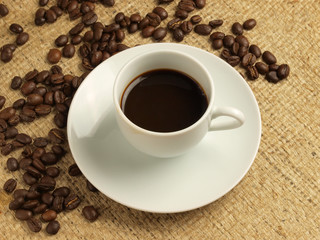 Cup of coffee and coffee beans.