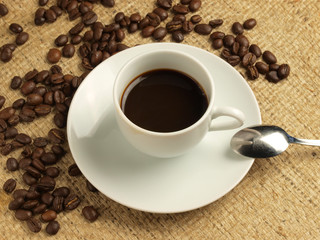 Cup of coffee and coffee beans.