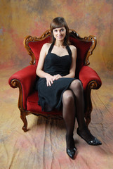Fototapeta na wymiar young woman sitting on the chair