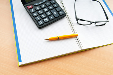 Business concept with notepad and calculator