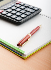 Business concept with notepad and calculator