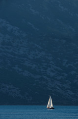 Yacht against cliffs