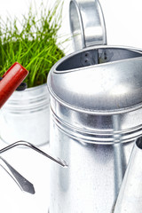 Garden tools with grass on white