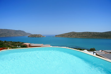Swimming pool area with sea view, Crete, Greece