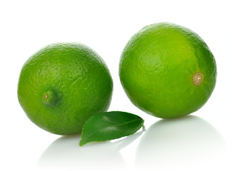 Limes with leaf on a white background