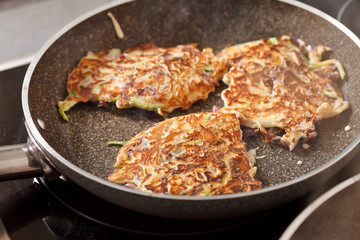 vegetables pancakes on the pan