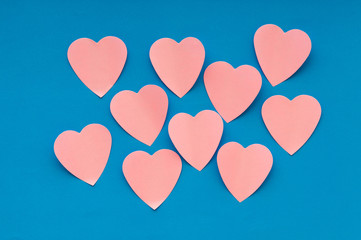 Heart shaped sticky notes on the background
