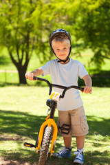 Obraz premium Boy with his bike