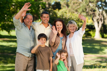 Family looking at the camera in the park