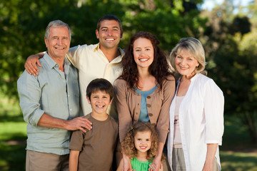 Family looking at the camera in the park