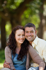 Naklejka premium Couple sitting in the garden