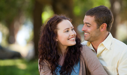 Naklejka premium Couple sitting in the garden