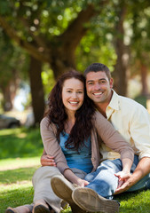 Naklejka premium Couple sitting in the garden