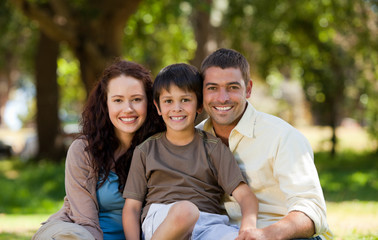 Joyful family sitting in the garden