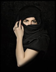 Young, beautiful woman posing in studio