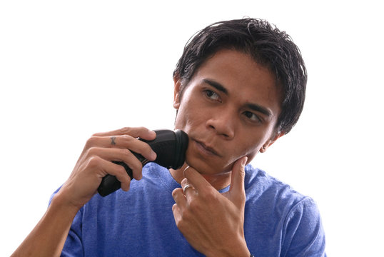 Man Shaving with Electric Shaver