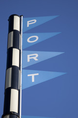 Port Sign against Blue Sky Background